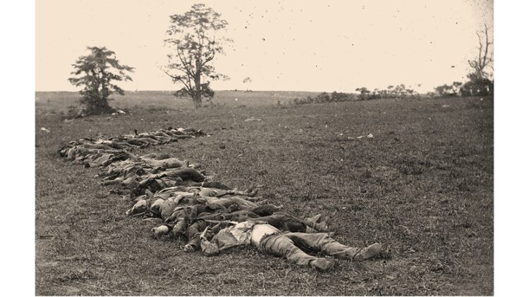 photo of Confederate dead gathered for burial after the Battle of Antietam (public domain)