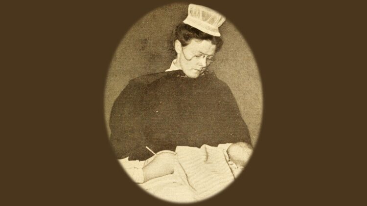 1913 photo of baby with thermometer inserted (public domain)