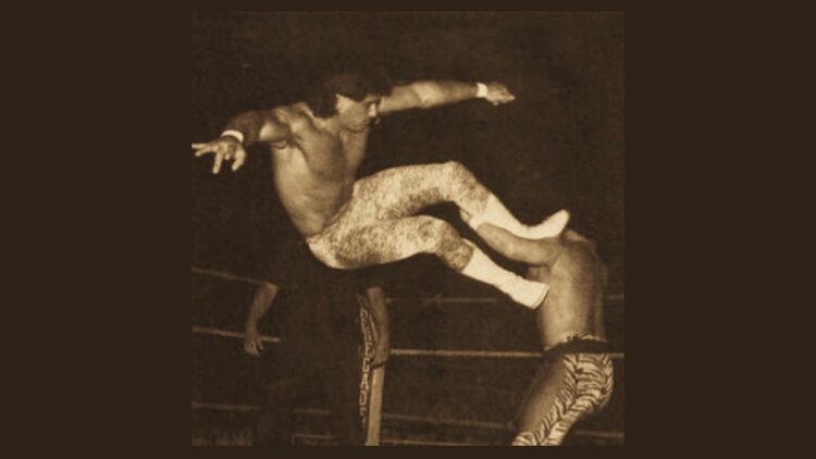 'KO': A Poem by Alec Ream 1 Tom Brandi performs a drop kick against Pat Tanaka during a professional wrestling match, circa 1988 (public domain)