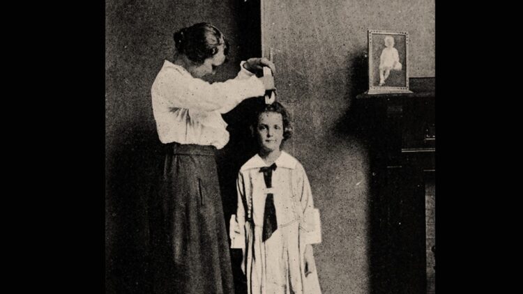 photo of a girl's height being measured, 1922 (public domain)