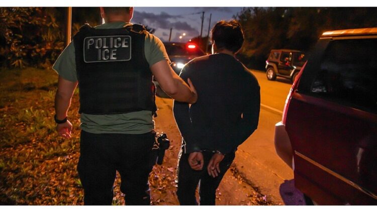 photo of a U.S. Immigration and Customs Enforcement (ICE) officer arresting someone (public domain)