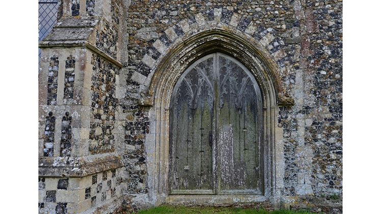 'Black Shuck': A Poem by Martin Briggs 1 a photo of Holy Trinity Church, Blythburgh's North Doorway by Michael Garlick